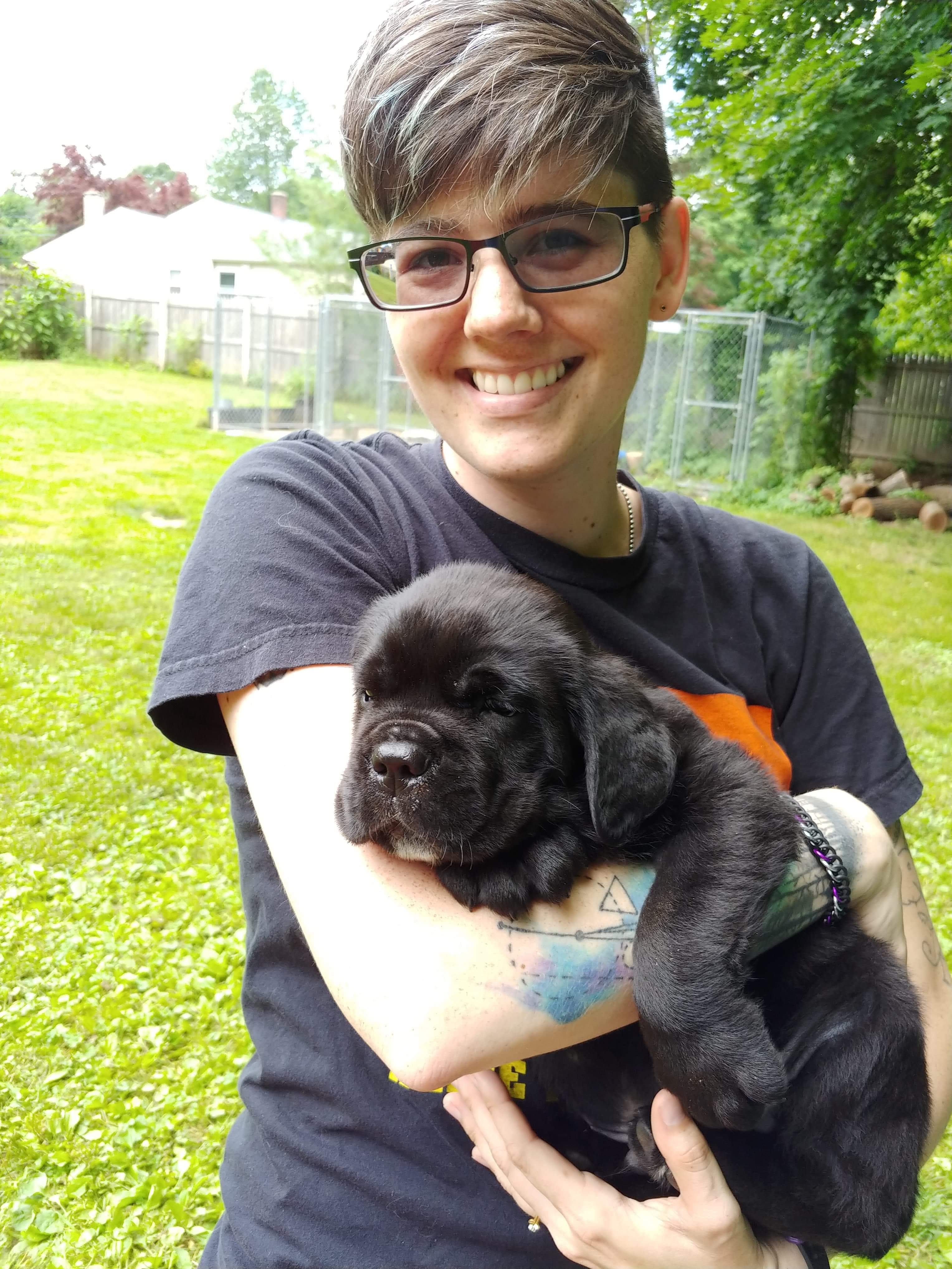 Brittni Hyzer holding a puppy